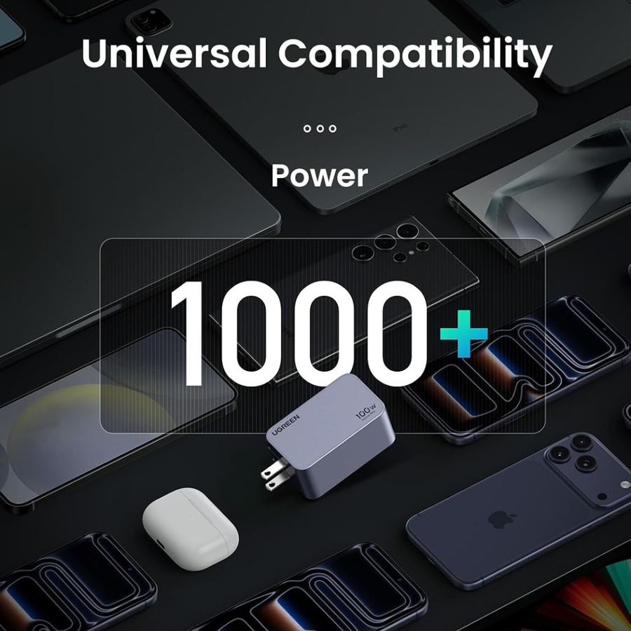 A promotional graphic for a universal 1000W power adapter. The central product is a compact gray USB-C power brick with a white plug, surrounded by various smartphones, earbuds in a charging case, and other electronic accessories on a dark background.