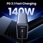 UGREEN 140W PD 3.1 fast charging adapter shown in front of a laptop and phone, with large text reading 'PD 3.