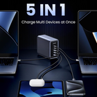 A 5-in-1 multi-device charger shown with cables connected to two laptops, a tablet, and a smartphone case. The central charger unit is dark gray with multiple ports, and the image includes the text '5 IN 1 Charge Multi Devices at Once' on a dark blue background.