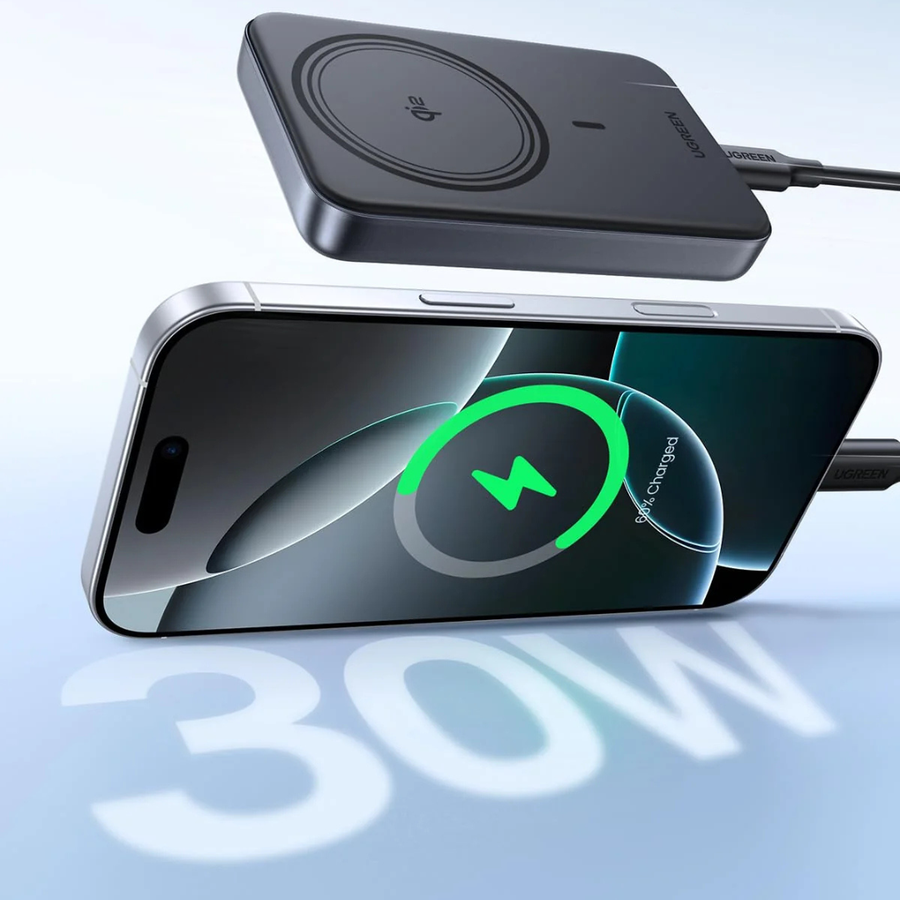 A wireless charging pad in black is shown above a smartphone displaying a green 30W wireless charging icon, with a cable plugged in. The phone is floating over a light blue gradient background with a large '30W' text reflection below.