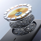 Close-up of a smartphone showing layered internal components, including a gold-toned circular coil, a black circuit board, and a small blue processor labeled 'NTC', on a light blue studio background.