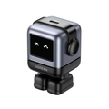 UGREEN mini robot action camera with a silver and black metallic body, a small pixel display showing a face, and a round side button, isolated on a white background.