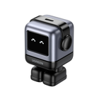 UGREEN mini robot action camera with a silver and black metallic body, a small pixel display showing a face, and a round side button, isolated on a white background.